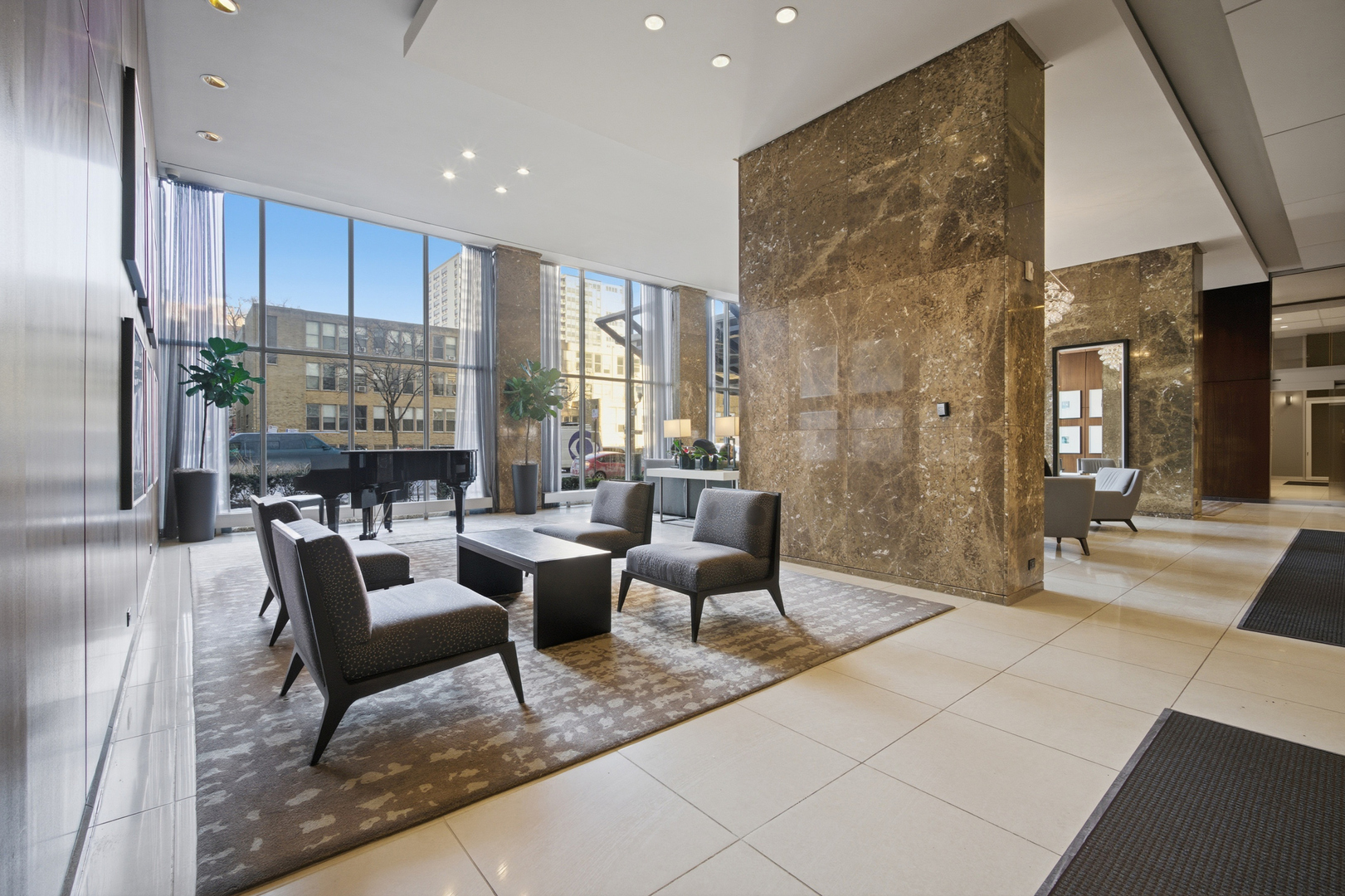 655 West Irving Park Road, Unit 2916 Chicago, IL 60613 - Photo 18 of 28 a living room with fireplace furniture and a large window