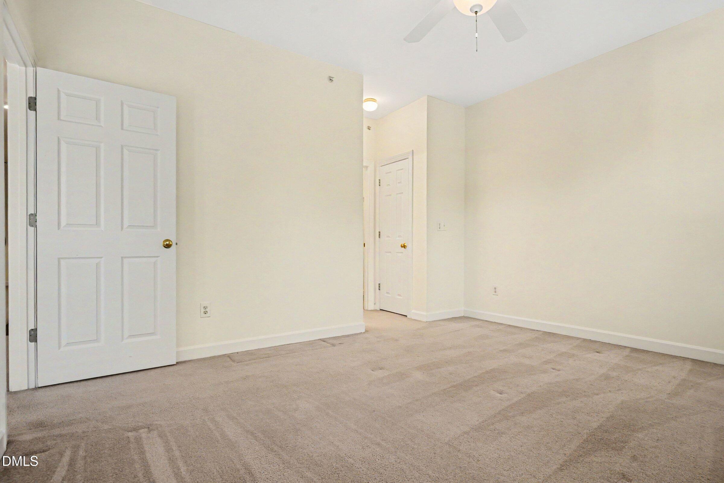 2651 Mellowfield Drive, Unit 203 Raleigh, NC 27604 - Photo 12 of 32 an empty room with an entryway
