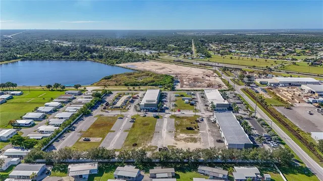 an aerial view of residential building and lake