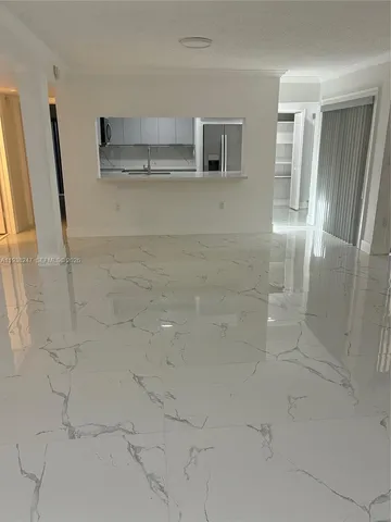 a kitchen with stainless steel appliances a refrigerator sink and microwave