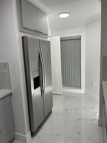 a view of an empty room with a door