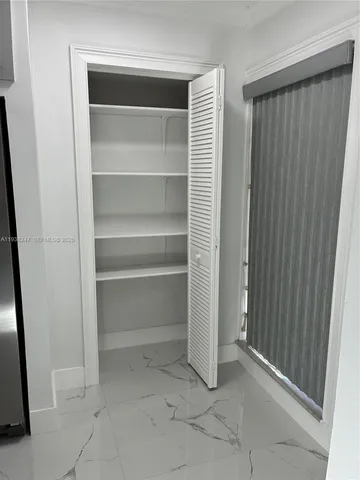 a kitchen with stainless steel appliances a sink a stove and a refrigerator