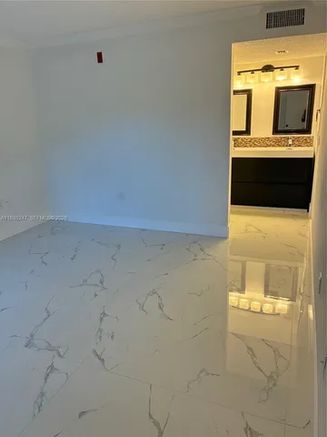 a bathroom with a toilet and shower