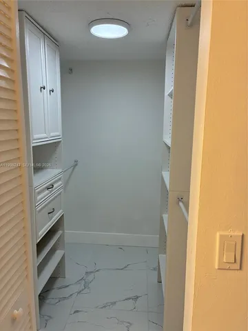 a view of an empty walk in closet