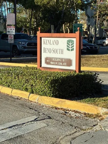 a view of a swimming pool with a yard