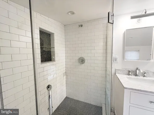 a bathroom with a sink and mirror