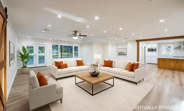 a living room with furniture and a large window