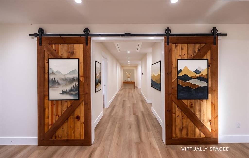 4505 Harrison Street Bellmead, TX 76705 - Photo 14 of 39 a view of a hallway with wooden floor and a bathroom