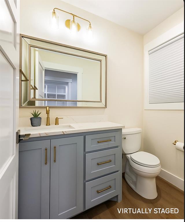 4505 Harrison Street Bellmead, TX 76705 - Photo 22 of 39 a bathroom with a granite countertop toilet sink and mirror