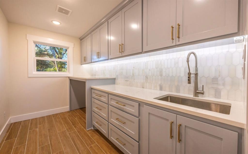 4505 Harrison Street Bellmead, TX 76705 - Photo 23 of 39 a kitchen with a sink and cabinets