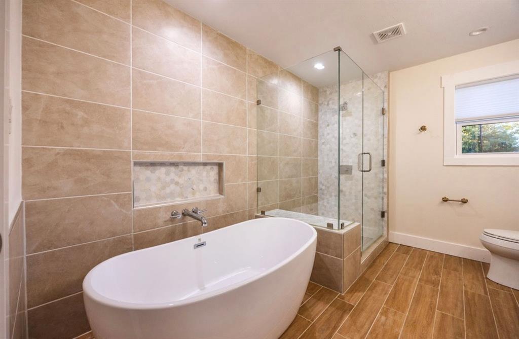 4505 Harrison Street Bellmead, TX 76705 - Photo 27 of 39 a bathroom with a sink and bathtub with shower