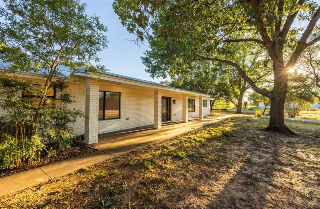 4505 Harrison Street Bellmead, TX 76705 - Photo 28 of 39 a front view of a house with a yard