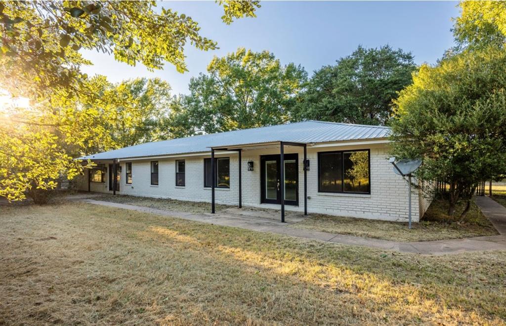 4505 Harrison Street Bellmead, TX 76705 - Photo 30 of 39 a front view of a house with a yard
