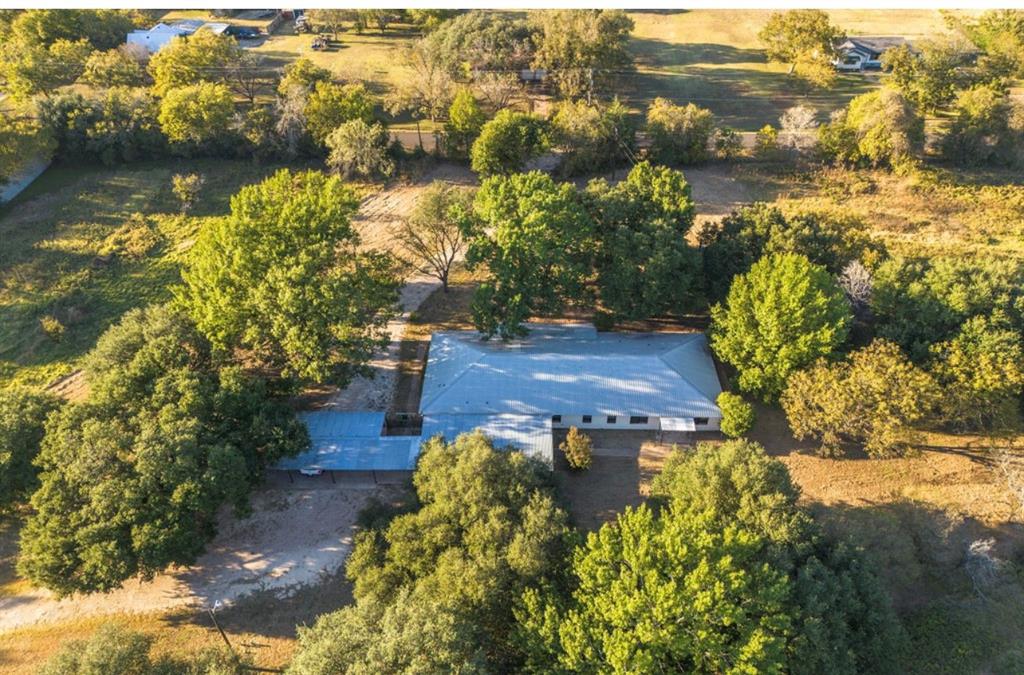 4505 Harrison Street Bellmead, TX 76705 - Photo 37 of 39 a view of a lake with lawn chairs and large trees