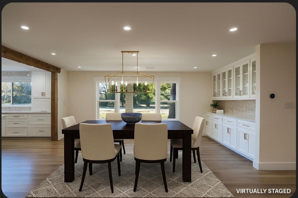 4505 Harrison Street Bellmead, TX 76705 - Photo 6 of 39 a view of a dining room with furniture window and wooden floor