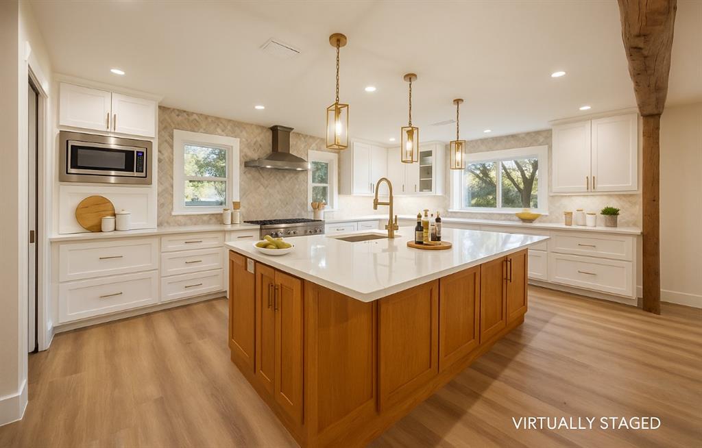 4505 Harrison Street Bellmead, TX 76705 - Photo 8 of 39 a kitchen with stainless steel appliances kitchen island granite countertop a sink a stove and cabinets