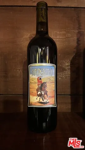 a view of a balcony with wooden floor and outdoor seating