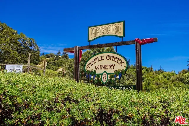 a view of a sign board with a house