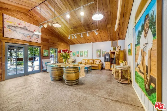 a view of a room with large windows