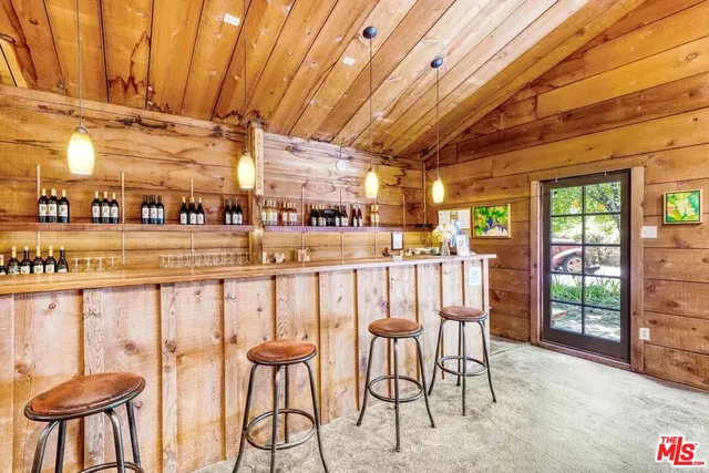 a kitchen with stainless steel appliances granite countertop a stove and wooden floor