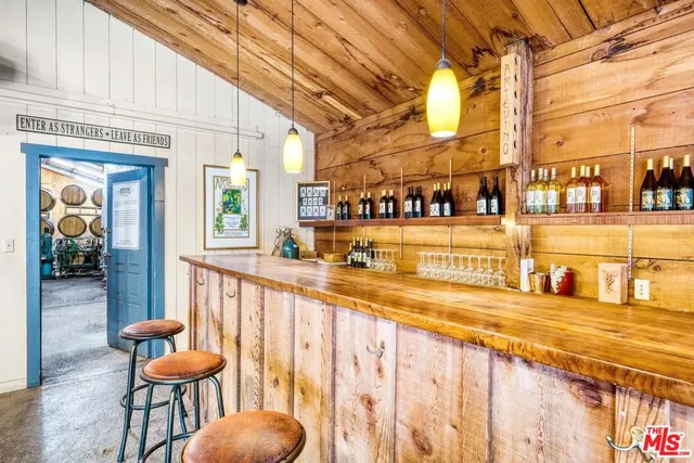a view of a livingroom with furniture window and wooden floor