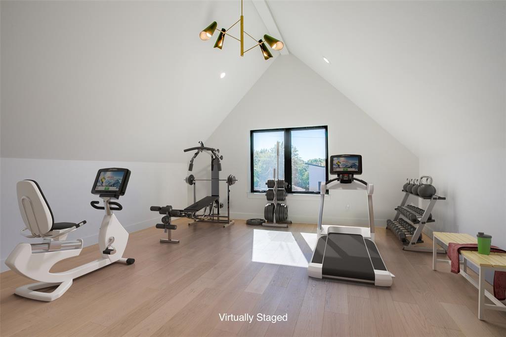 4311 Merrell Road Dallas, TX 75229 - Photo 23 of 30 a living room with furniture gym equipment and a mirror