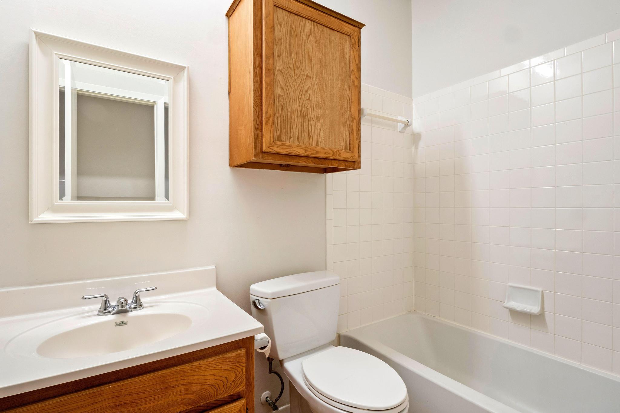 6501 Brush Country Road, Unit 109 Austin, TX 78749 - Photo 20 of 26 a bathroom with a sink toilet and shower