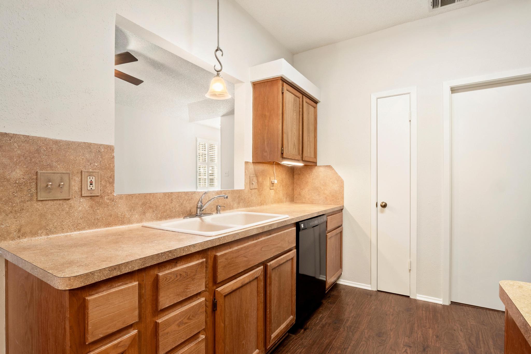 6501 Brush Country Road, Unit 109 Austin, TX 78749 - Photo 7 of 26 a bathroom with a sink and a mirror