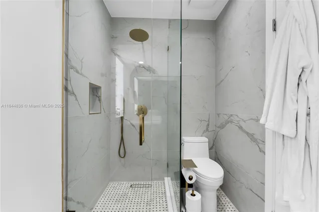 a large living room with furniture and a large window