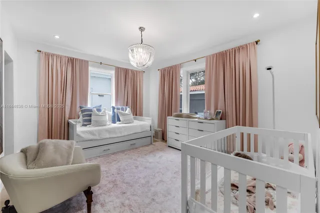 a bedroom with furniture and a window