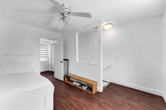 a bathroom with a sink toilet and window