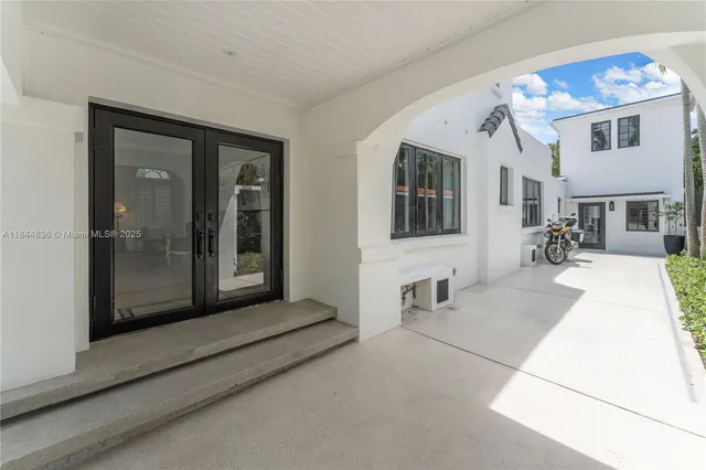 a bed room with furniture and a baby crib