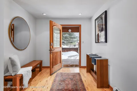 a hallway with a large window and a mirror