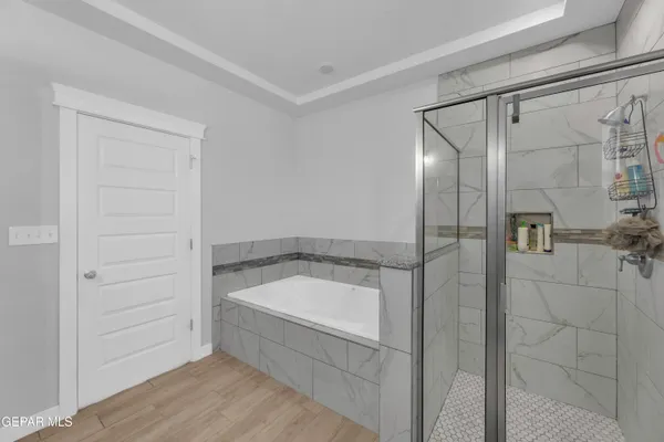 a bathroom with a bathtub and shower