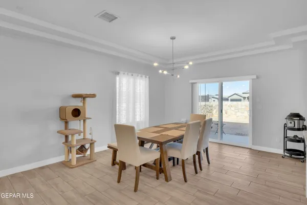 a view of a dining room with furniture and wooden floor