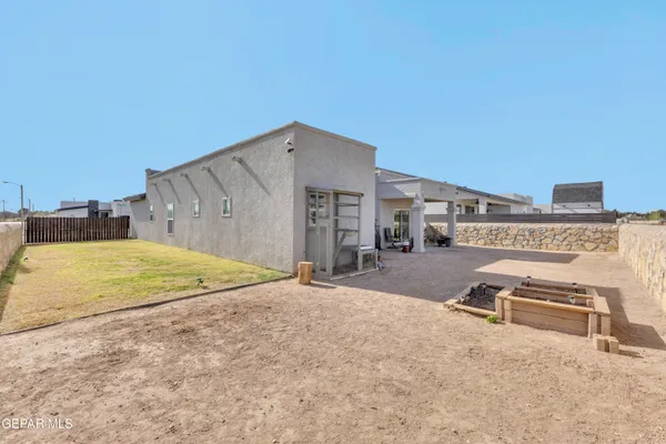 a swimming pool with outdoor seating and yard