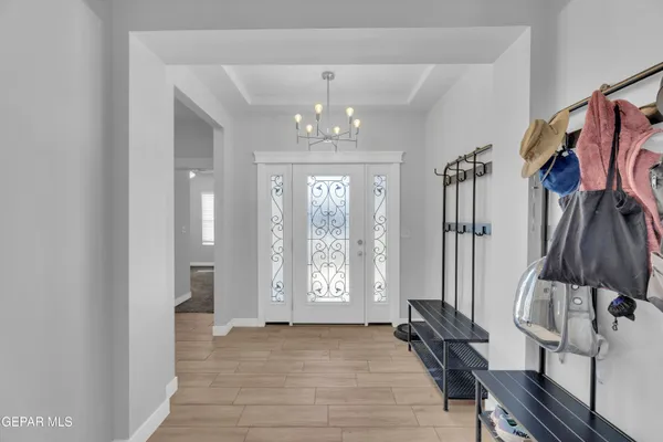 a view of an entryway with wooden floor and door