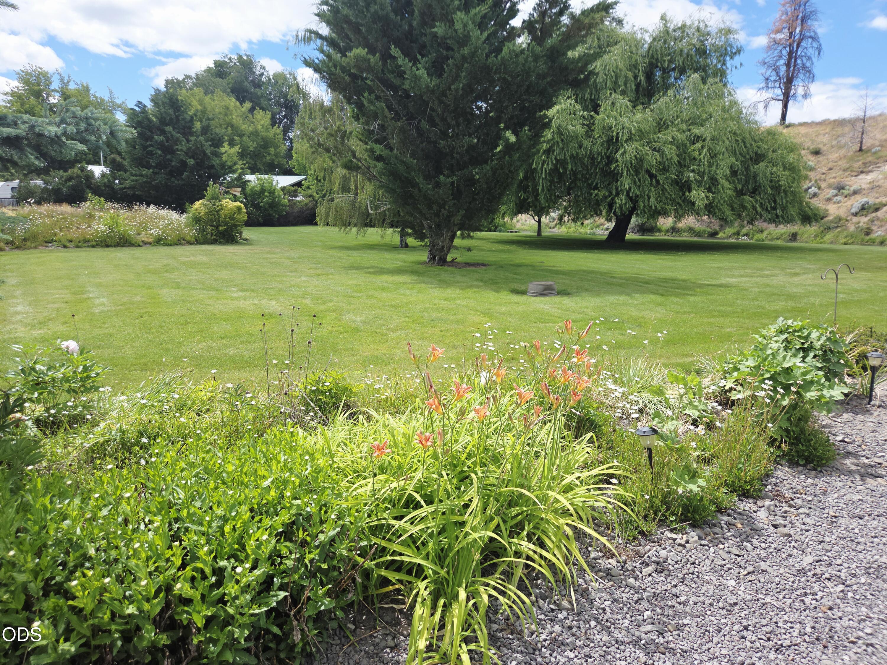 32928 Rivers Drive Chiloquin, OR 97624 - Photo 59 of 64 a view of a garden with a building in the background