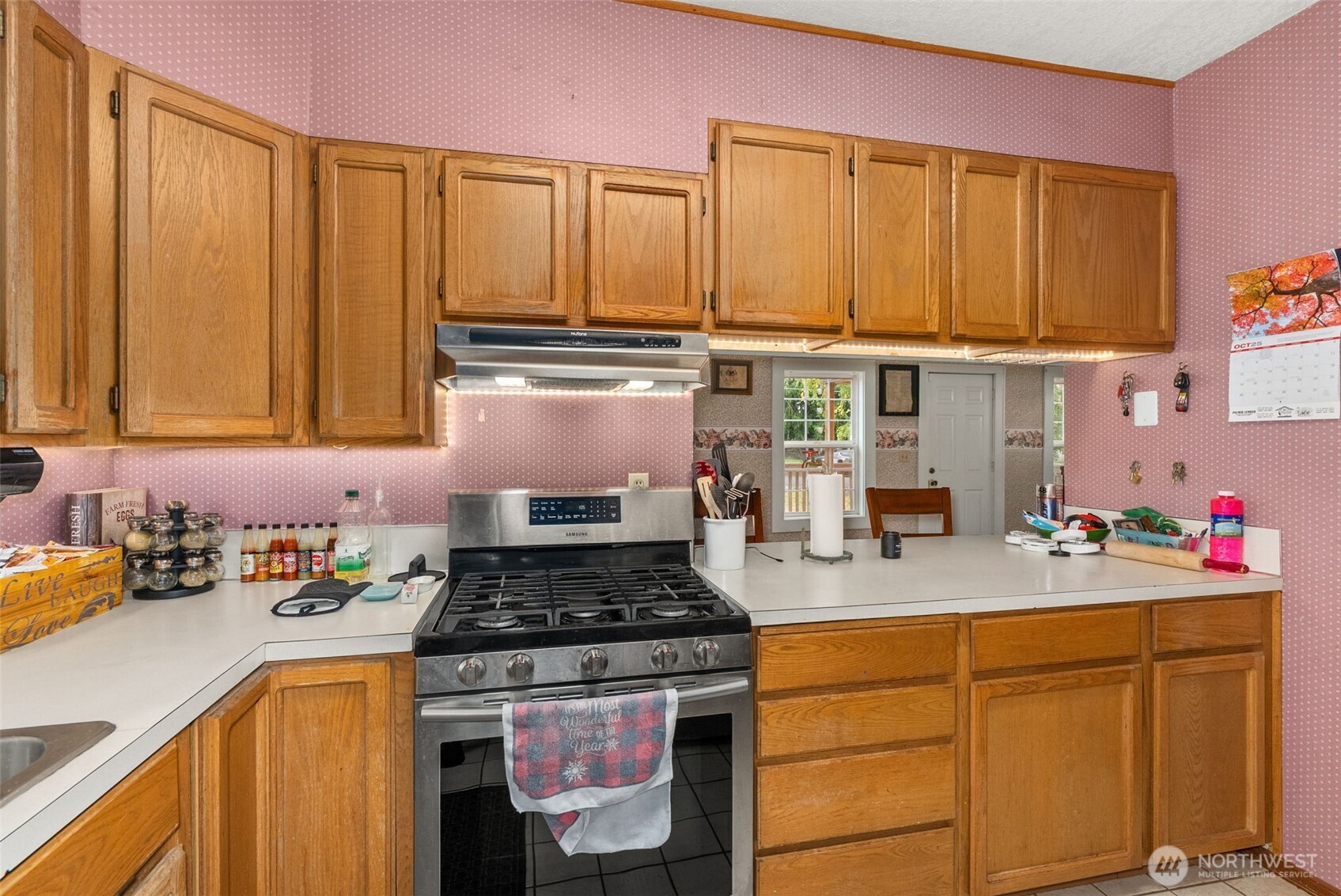535 Southwest 19th Street Chehalis, WA 98532 - Photo 13 of 35 a kitchen with stainless steel appliances granite countertop a stove a sink dishwasher and cabinets with wooden floor