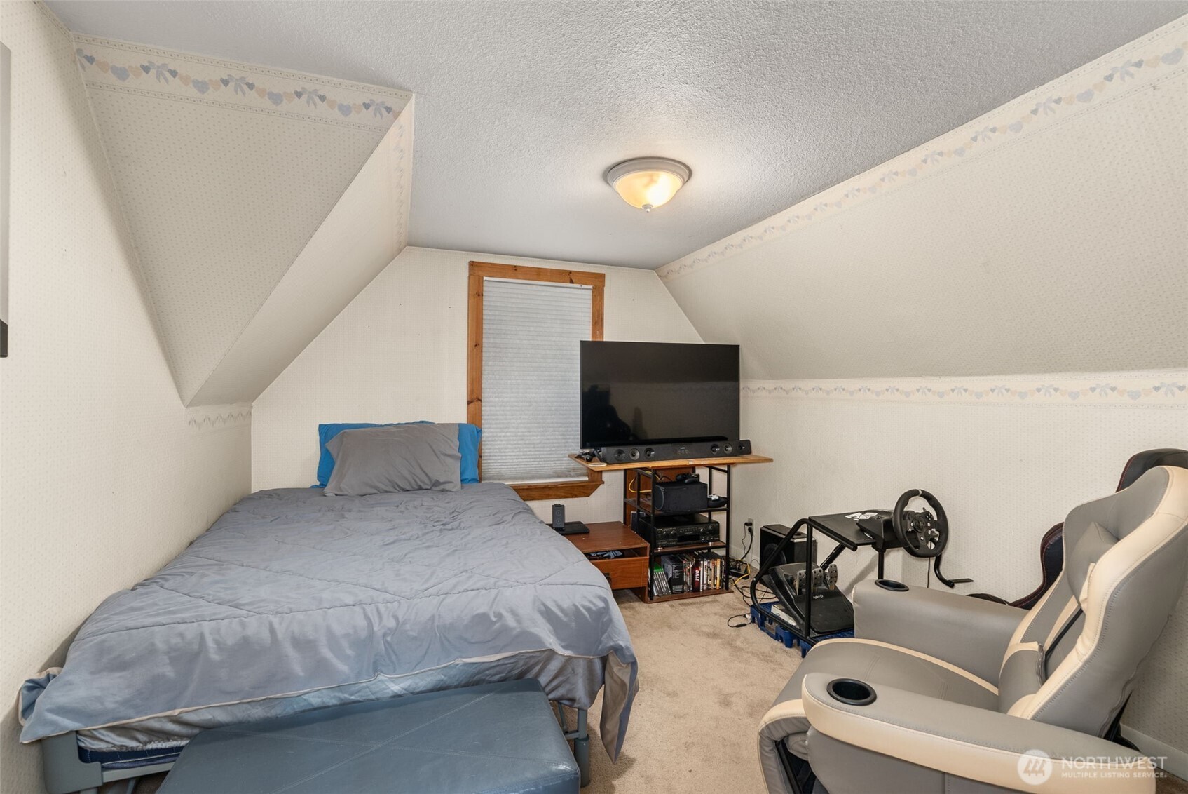 535 Southwest 19th Street Chehalis, WA 98532 - Photo 25 of 35 a bedroom with furniture and a flat screen tv