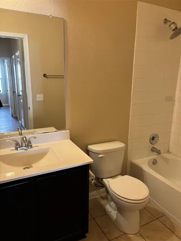 a view of house with backyard