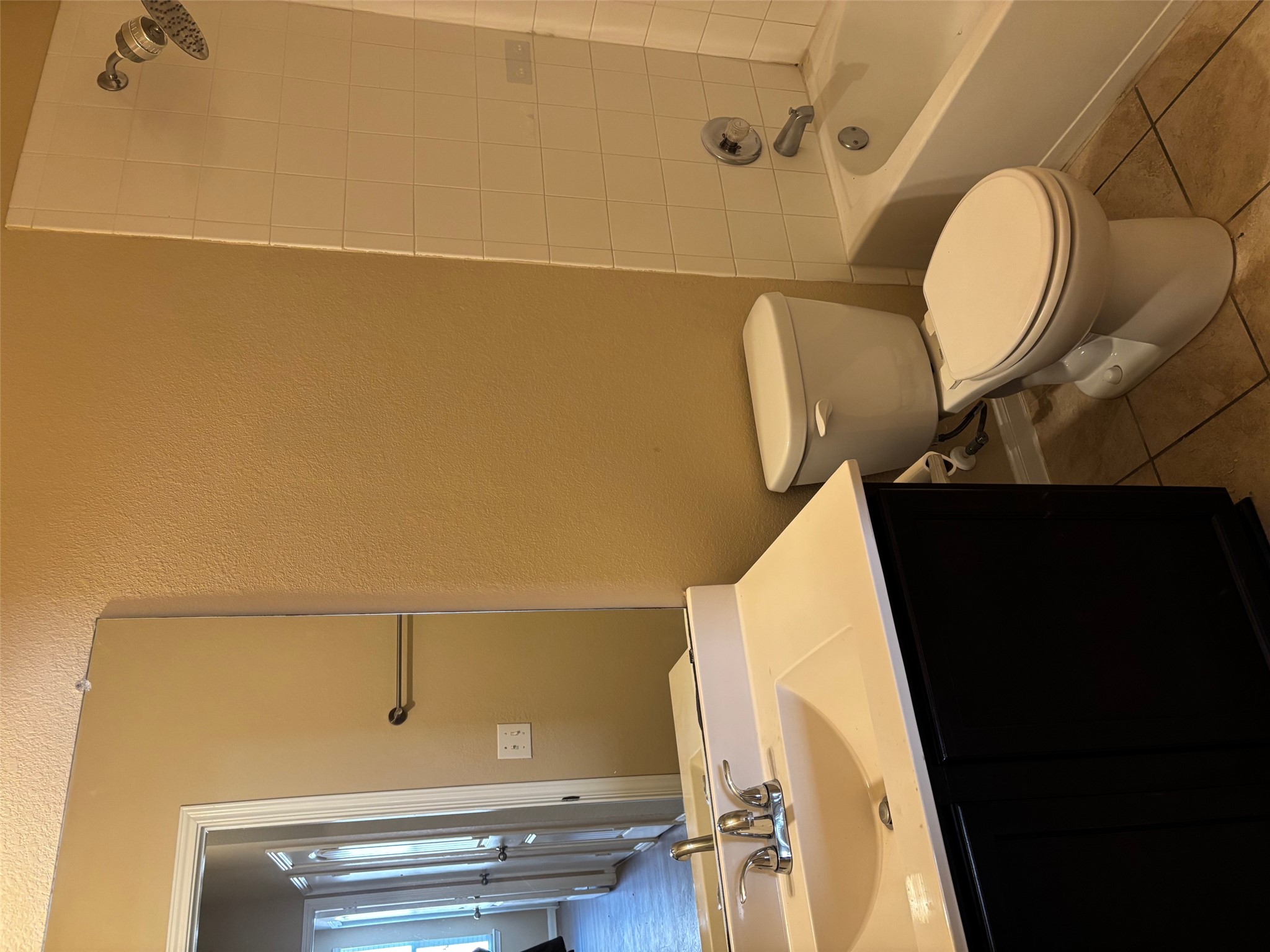 1602 Atlas Road Cedar Park, TX 78613 - Photo 12 of 13 Full bath with vanity, shower / bath combination, a textured wall, and light tile patterned floors