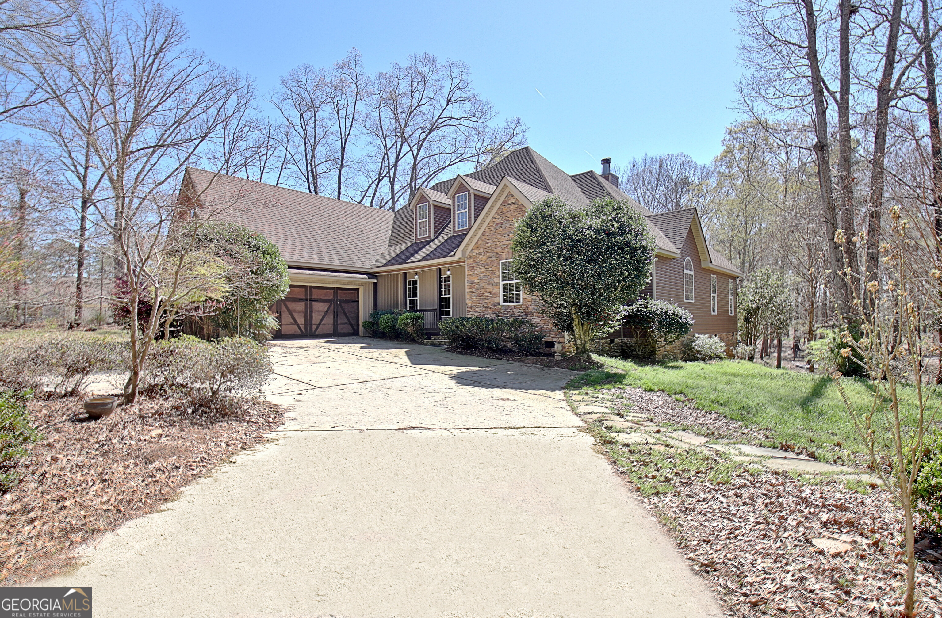373 Blanton Mill Road Williamson, GA 30292 - Photo 3 of 57 a house with trees in the background