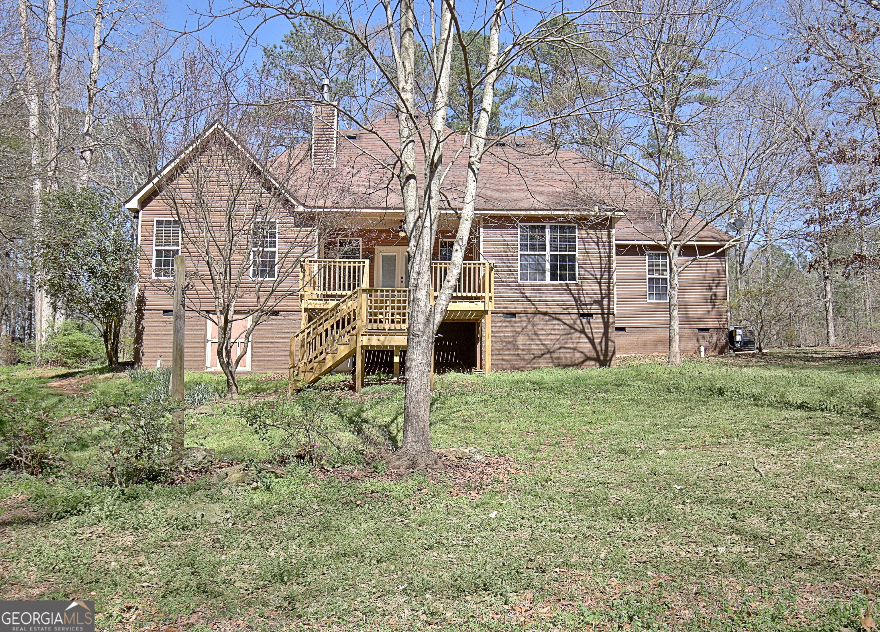 373 Blanton Mill Road Williamson, GA 30292 - Photo 42 of 57 a view of a yard in front of a house with a large tree