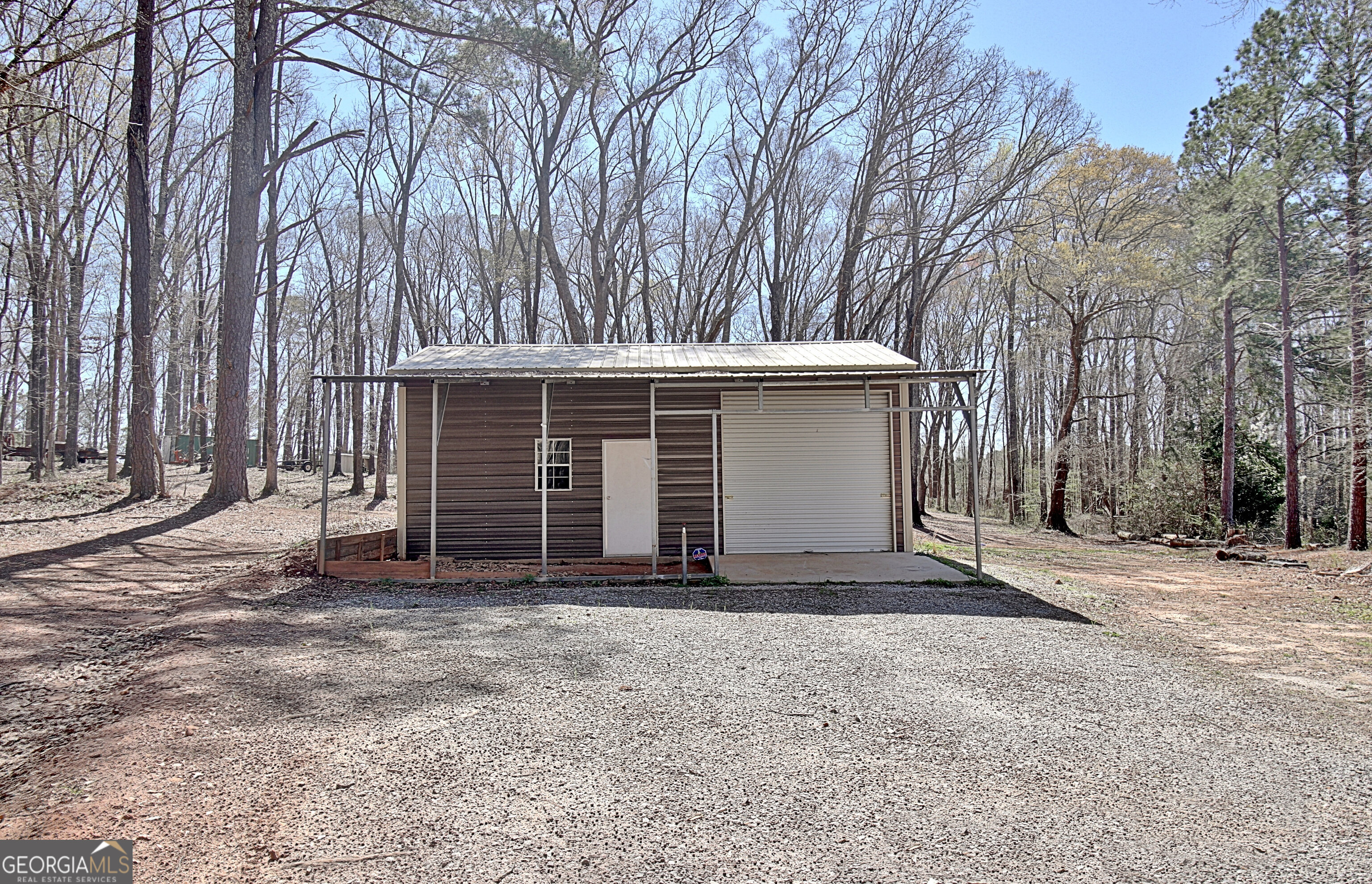 373 Blanton Mill Road Williamson, GA 30292 - Photo 51 of 57 a view of a house with a yard and garage