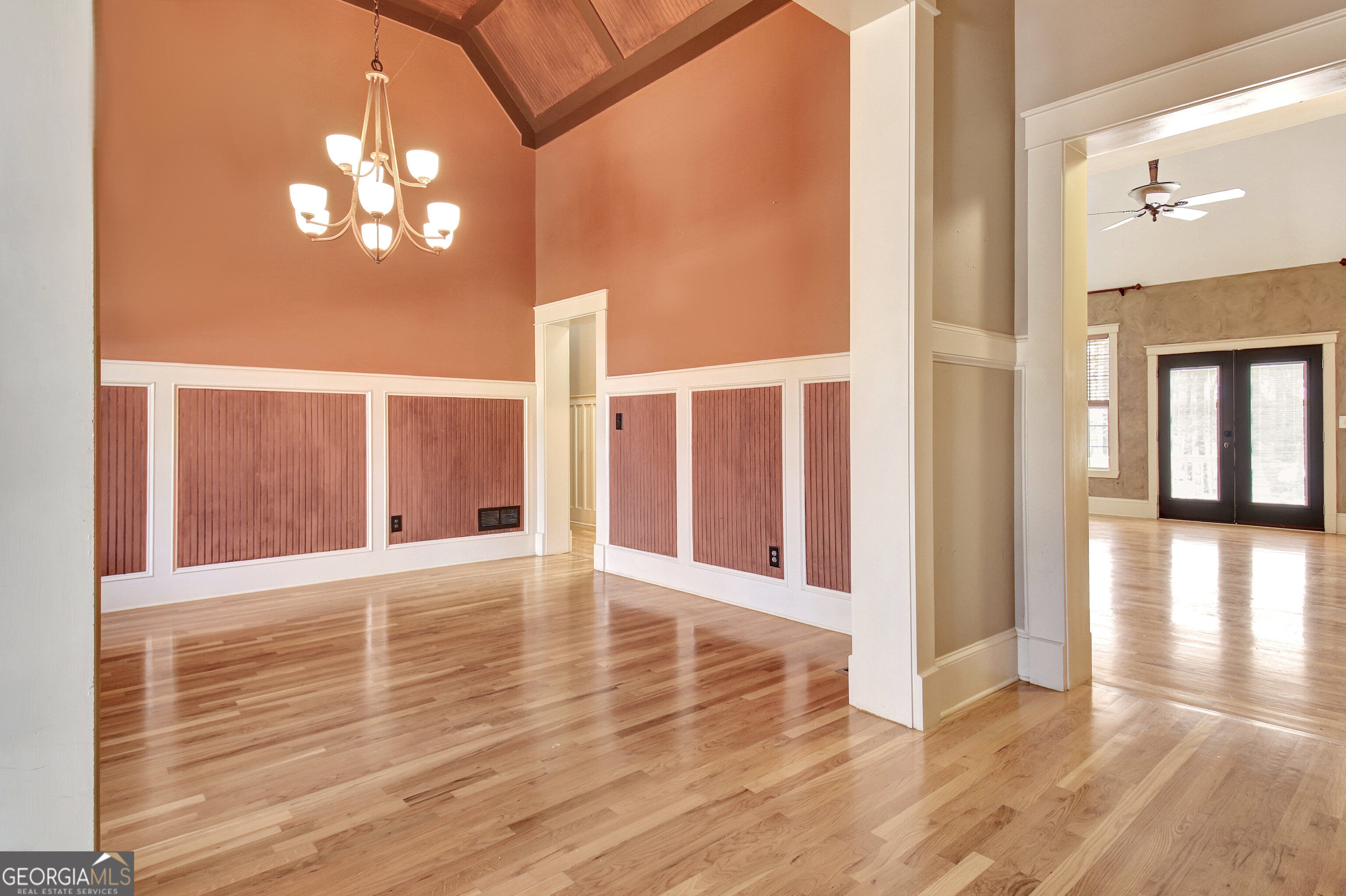 373 Blanton Mill Road Williamson, GA 30292 - Photo 8 of 57 a view of an empty room with wooden floor and a large window