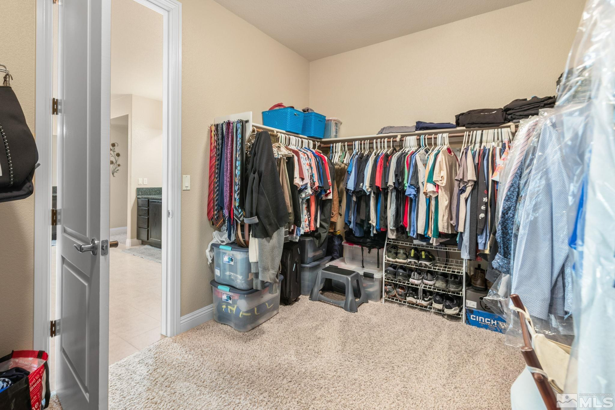2055 Back Nine Trail Reno, NV 89523 - Photo 24 of 40 a view of walk in closet with clothes and shoes