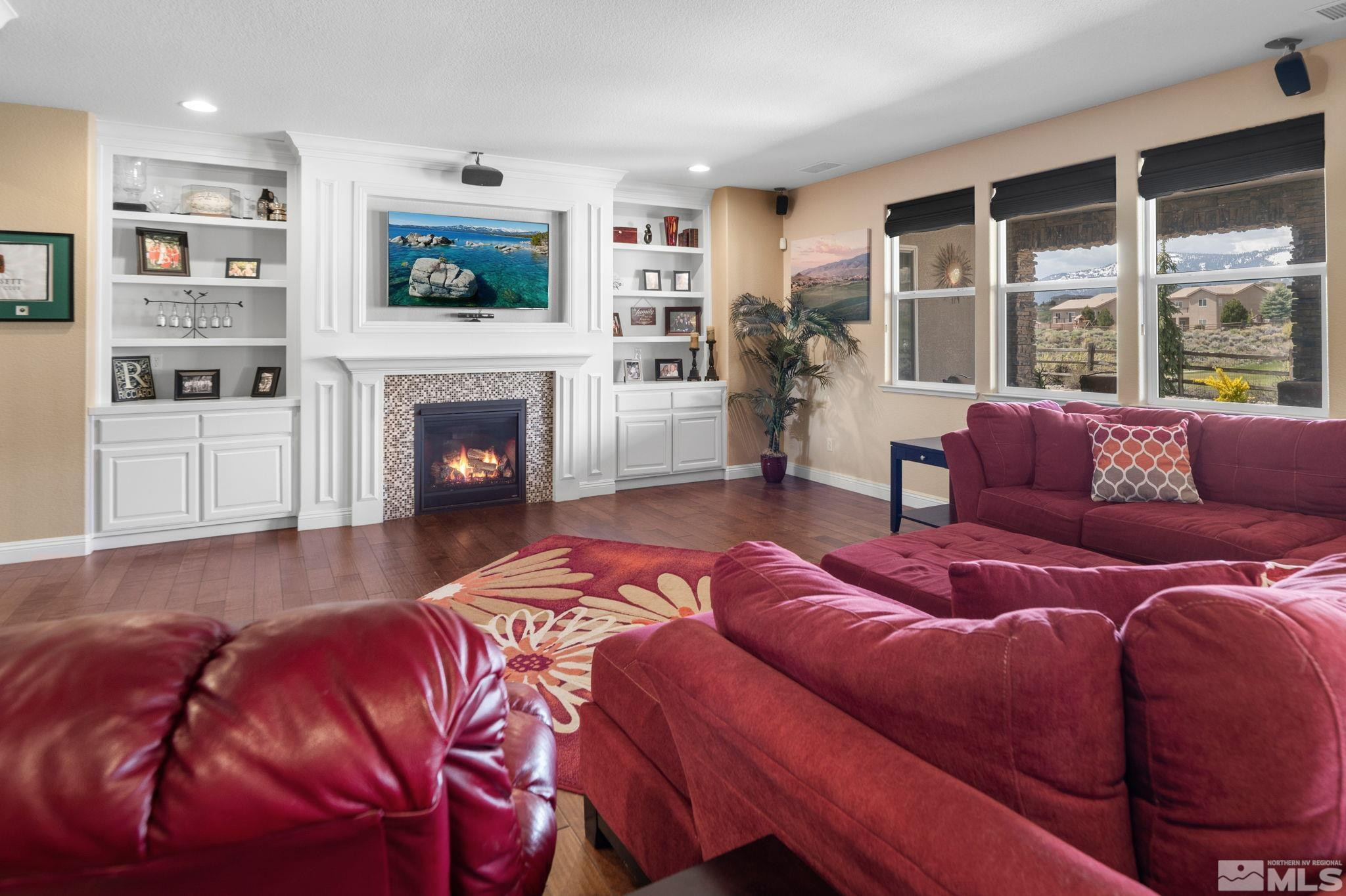 2055 Back Nine Trail Reno, NV 89523 - Photo 7 of 40 a spacious bedroom with a bed and a fireplace