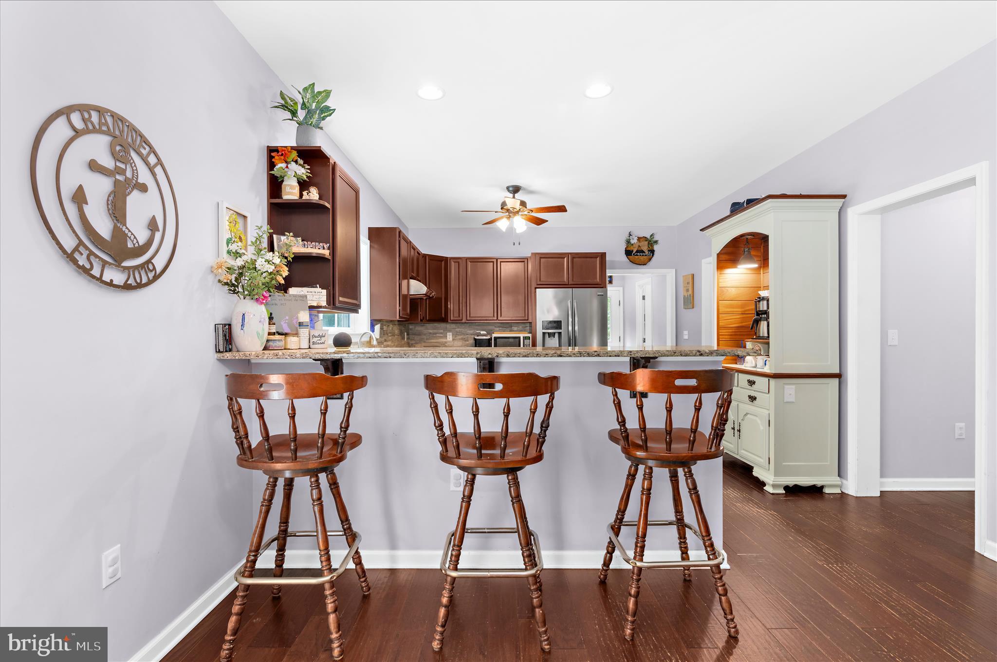 6941 Hubbard Road Hurlock, MD 21643 - Photo 11 of 71 a view of a dining room with furniture and wooden floor