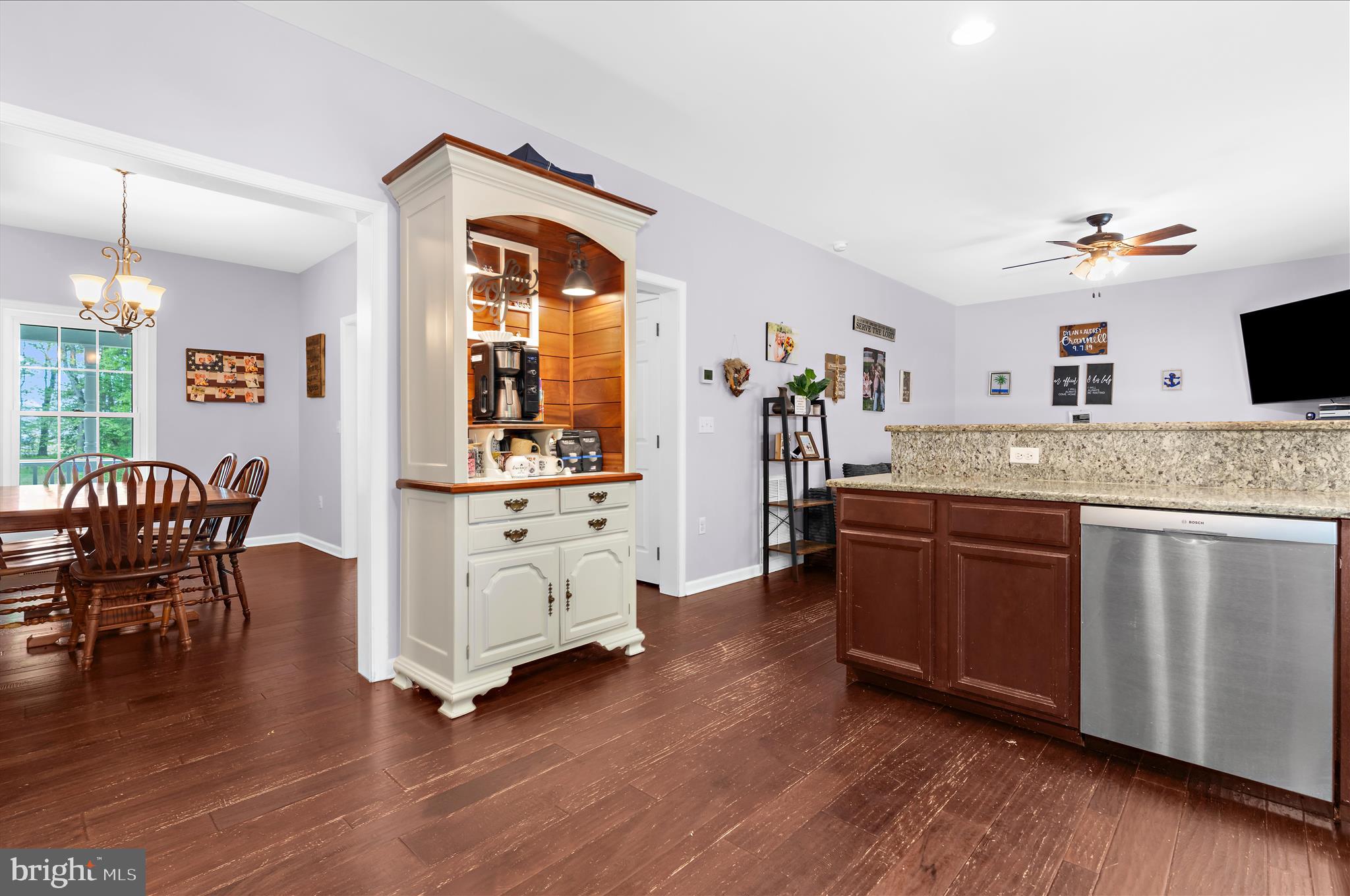 6941 Hubbard Road Hurlock, MD 21643 - Photo 13 of 71 a living room with granite countertop furniture and wooden floor